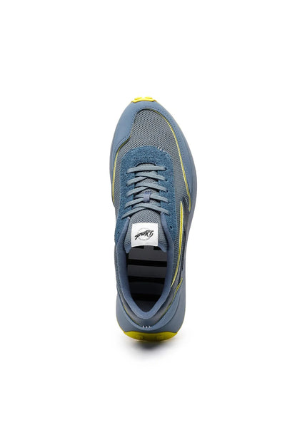Diesel blue mesh sneaker upper with gray laces and yellow trim, side view