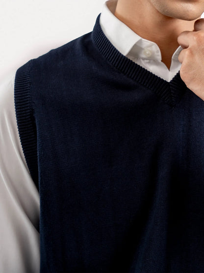 Dark blue V-neck sweater vest neckline with ribbed trim, sleeveless knit