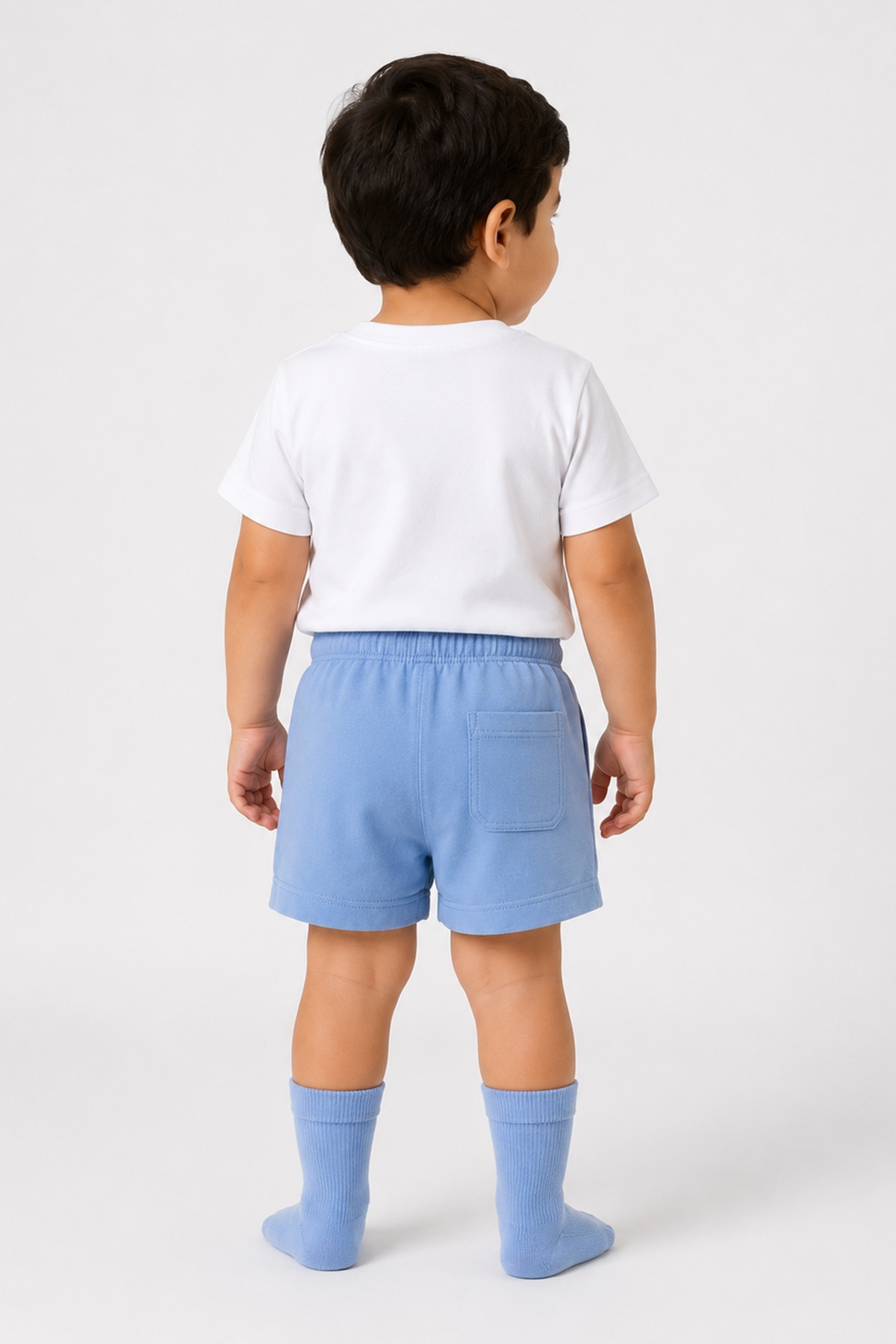 Blue infant socks with ribbed cuffs, worn by child from the back