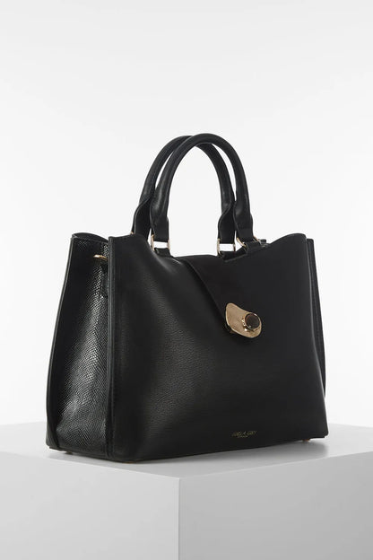 Black handbag with two top handles and front clasp detail, structured silhouette