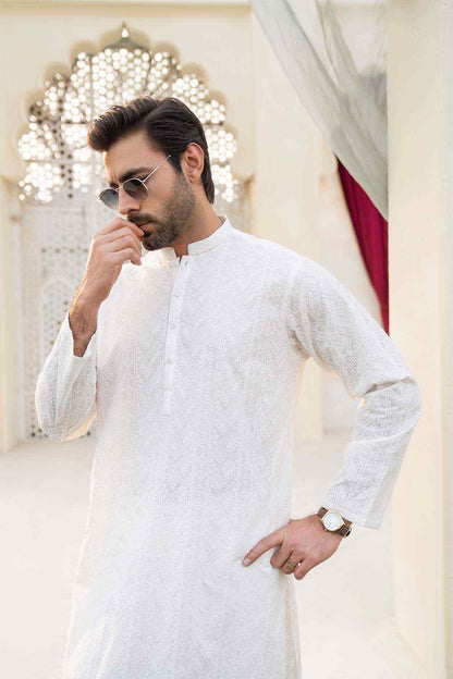 White embroidered long kurta with stand collar and long sleeves, relaxed standing pose