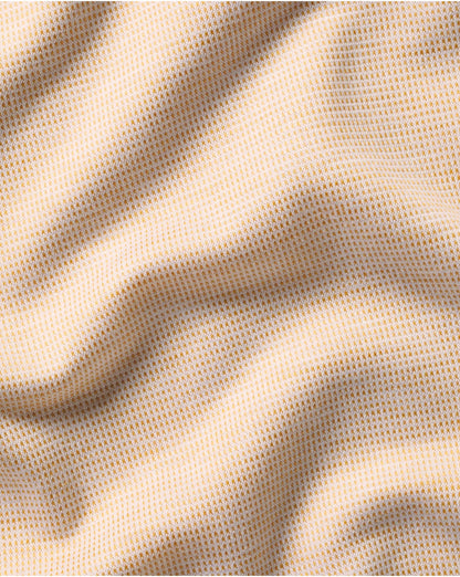 Charles Tyrwhitt polo fabric close-up, light tan micro-texture knit
