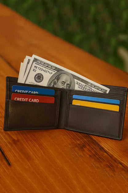 Black leather card holder open with credit card slots and cash pocket