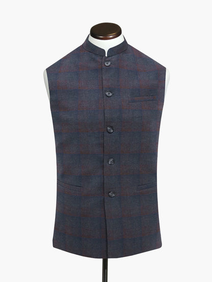 Dark plaid sleeveless vest with stand collar, button-front, and welt chest pocket