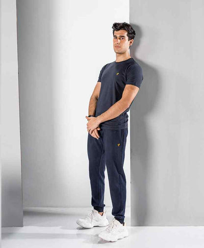 Fitted dark navy jogger pants with tapered fit and ankle cuffs