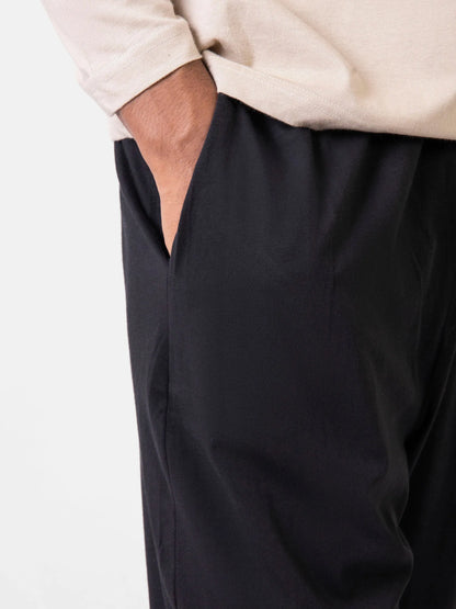 Brumano black cotton lounge pants, side view with relaxed fit and elastic waist