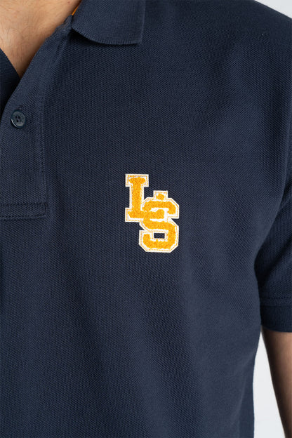 Close-up of navy polo shirt chest logo patch