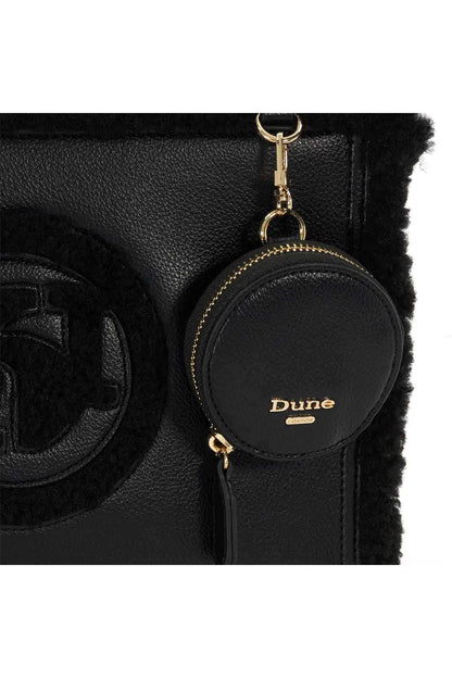 Black round charm zip pouch with Dune logo on fuzzy-trim handbag, gold chain.