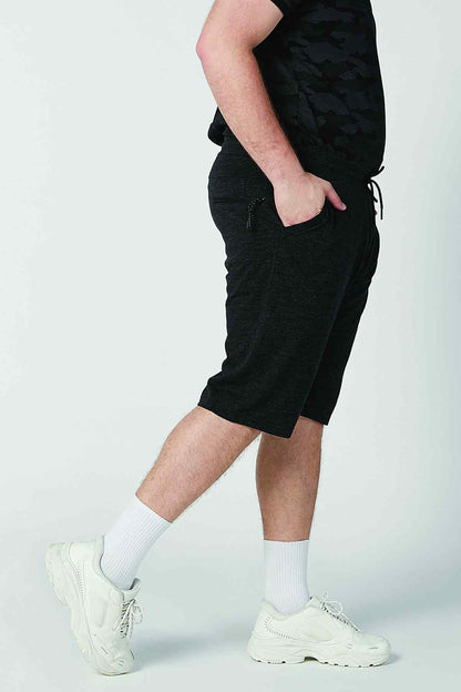 Men's black camo-print shorts, knee-length, side view
