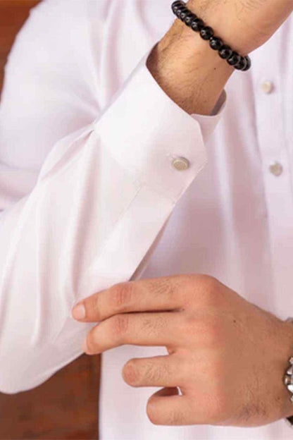 Men's white kurta sleeve cuff with button detail, close-up