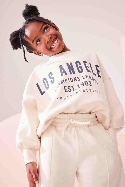 Ecru kids sweatshirt with Los Angeles EST.1982 print and jogger pants, elastic waist