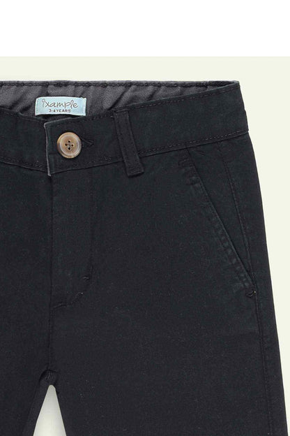 Black shorts close-up: button fly and slant front pockets