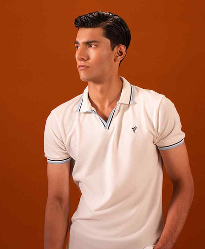 White fitted polo shirt with small chest logo and striped trim