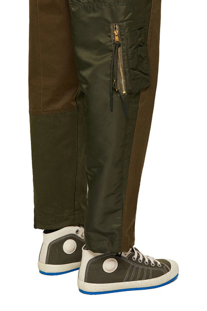 Dark green cargo pants with side zip pocket and tapered ankle cuffs