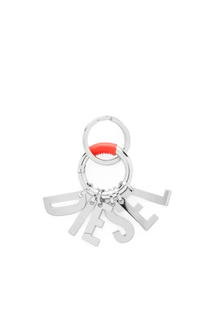 Diesel metal keychain with circular ring and grey letter charms, red accent center.