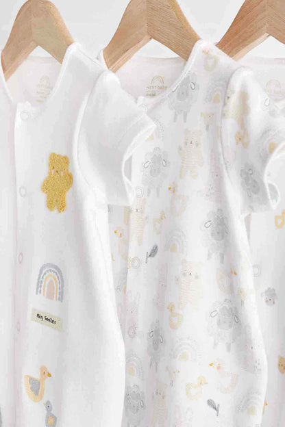 White short-sleeve bodysuit with animal and rainbow graphics; front snap placket
