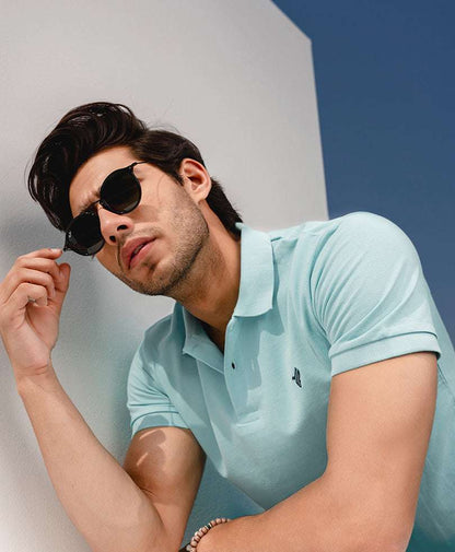 Light blue fitted polo shirt with short sleeves and button placket