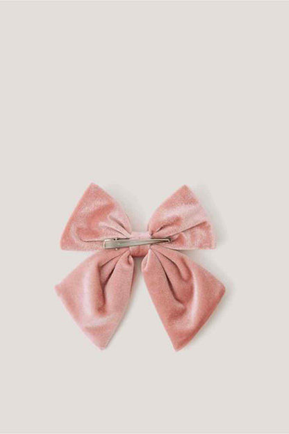Pink bow hair accessory with gathered center band and two layered tails