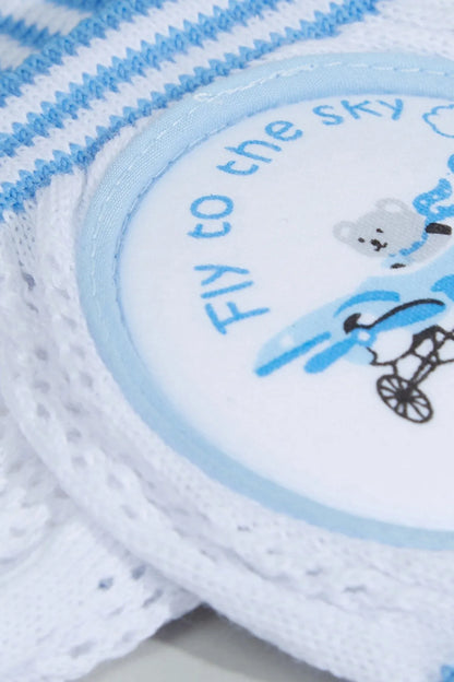Close-up of blue-and-white striped baby booties with airplane graphic
