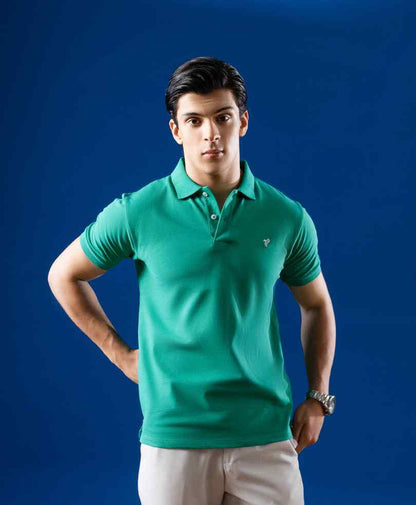 Fitted green polo shirt with short sleeves, buttoned collar, and small chest logo