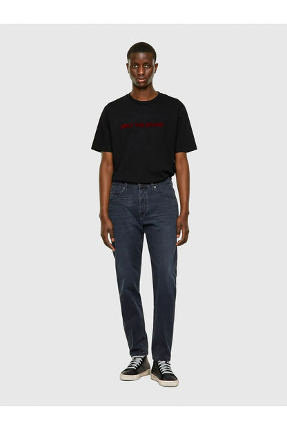 Dark blue denim jeans on model, straight leg, belt loops, button fly