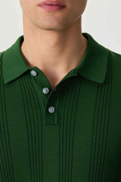 Green polo shirt collar close-up with three-button placket