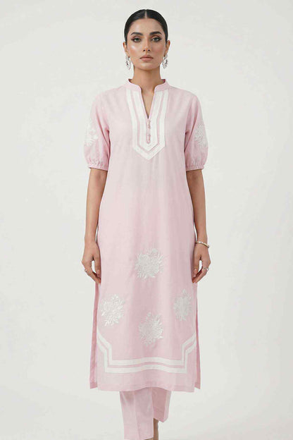 Light pink kurta with white-trim neckline, front embroidery, and short puff sleeves