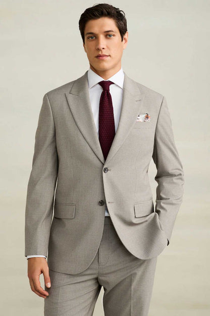 Men's light gray tailored suit with notch lapels, front blazer and dress tie.