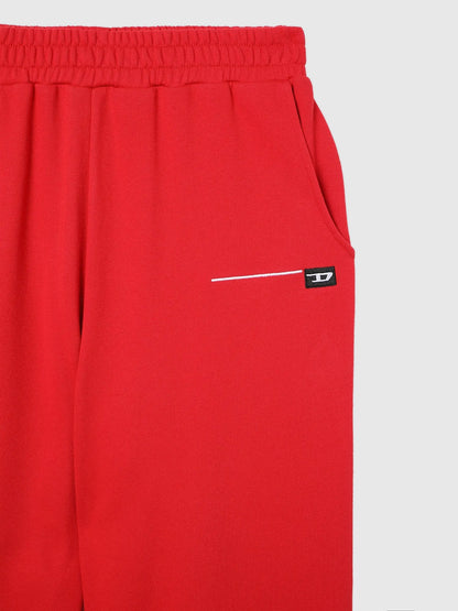 Diesel red jogger pants with elastic waistband, side pocket and logo patch detail