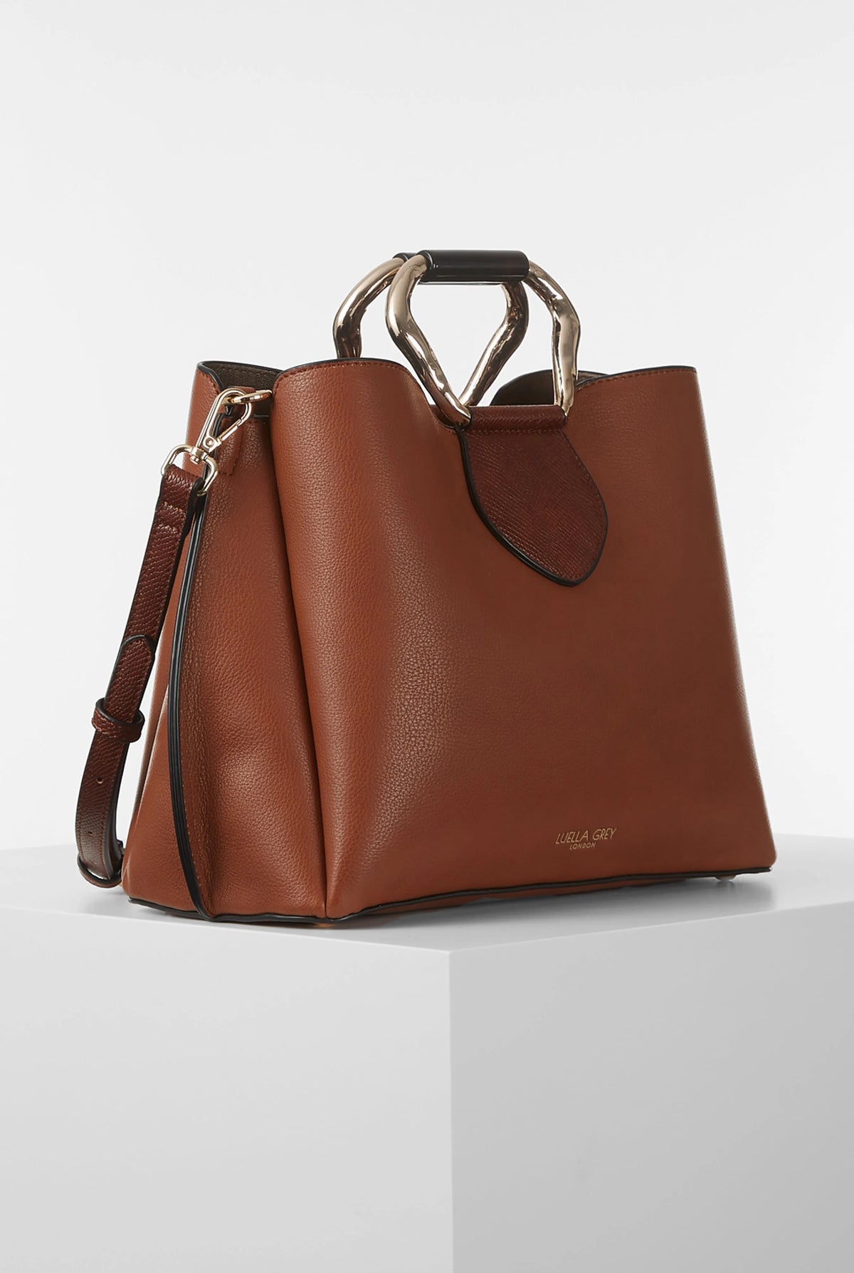 Brown structured handbag with top handle and side panels