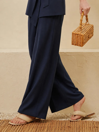 Navy wide-leg trousers with matching sleeveless wrap waistcoat and tie belt