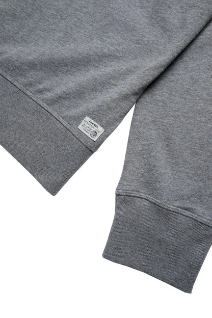 Grey hoodie sleeve and hem with small brand label near cuff; ribbed cuffs.