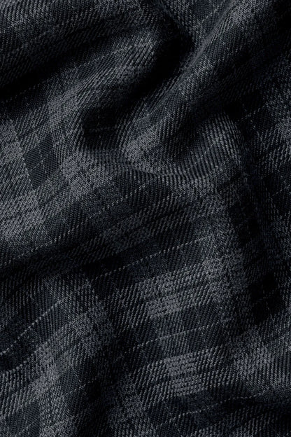 Grey and black check fabric with textured grid pattern
