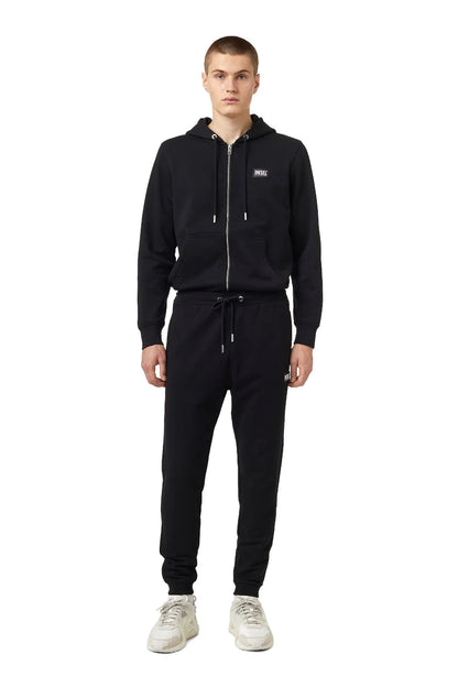 Black Diesel jogger pants with drawstring waist, tapered legs, elastic cuffs.