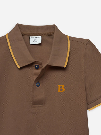 Brown cotton polo shirt close-up: yellow trim, blue button placket, and embroidered B