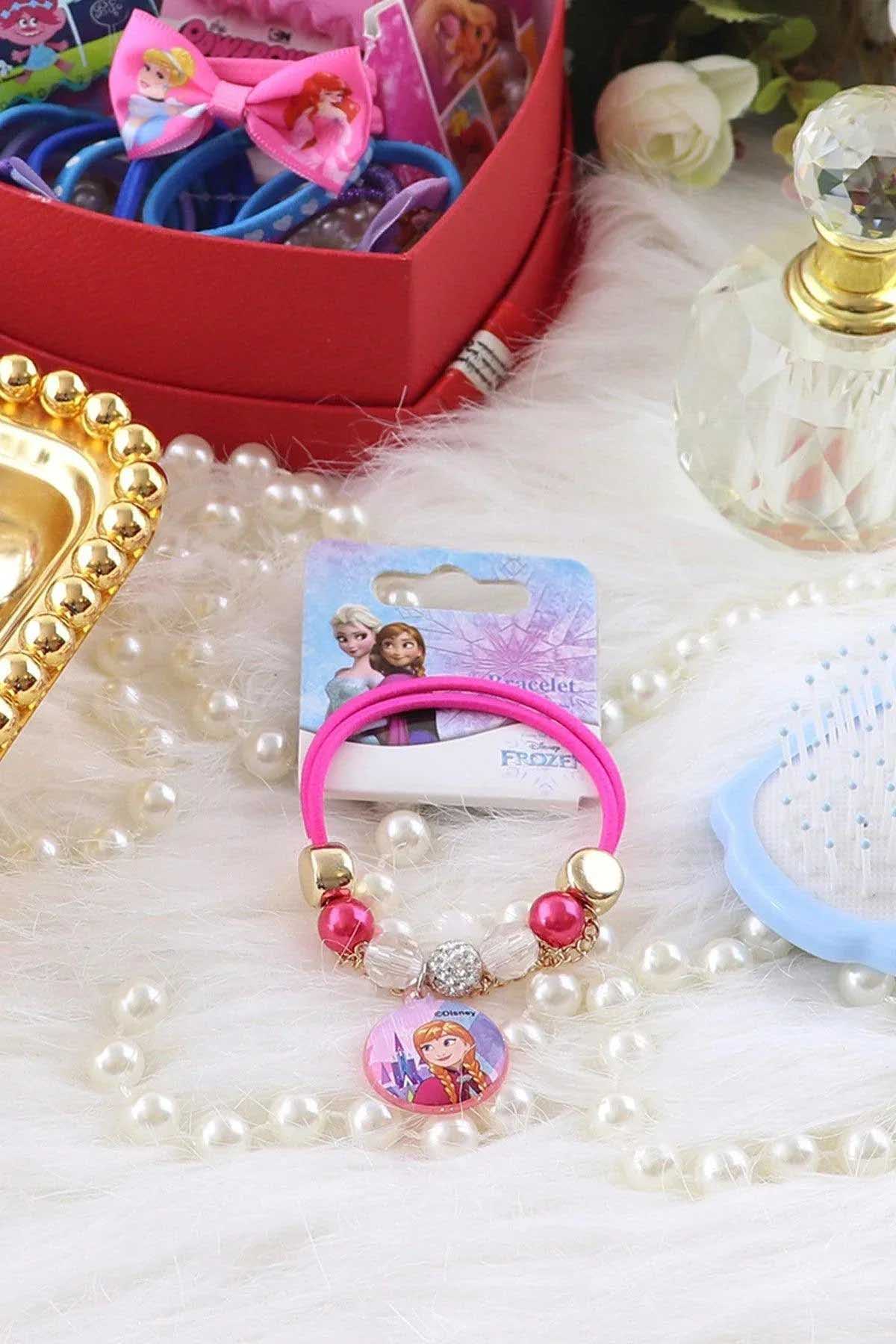Disney charm bracelet with pink elastic, bead accents, and round princess pendant