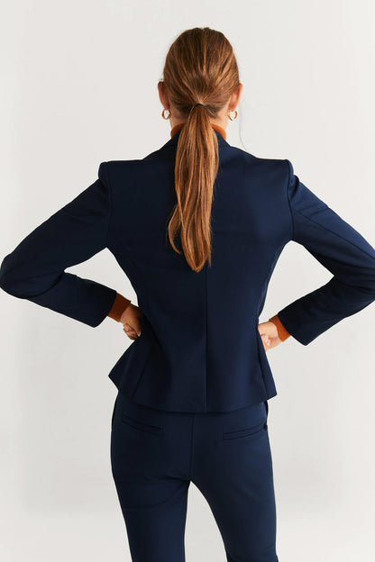 Navy women's suit, blazer back view with structured shoulders and matching pants