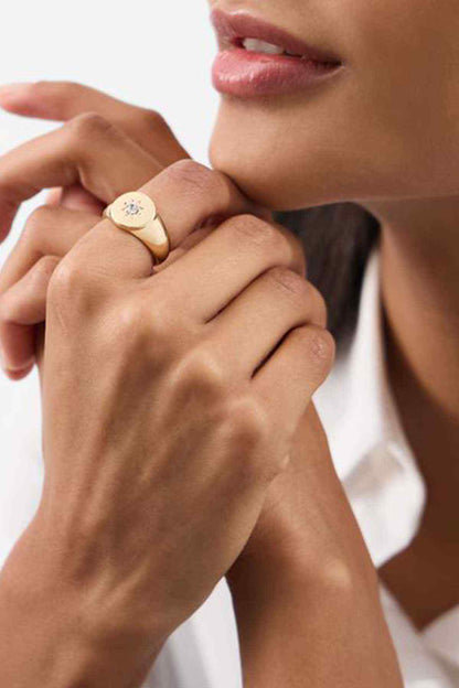 Accessorize gold-tone ring with starburst centerpiece on a slim band