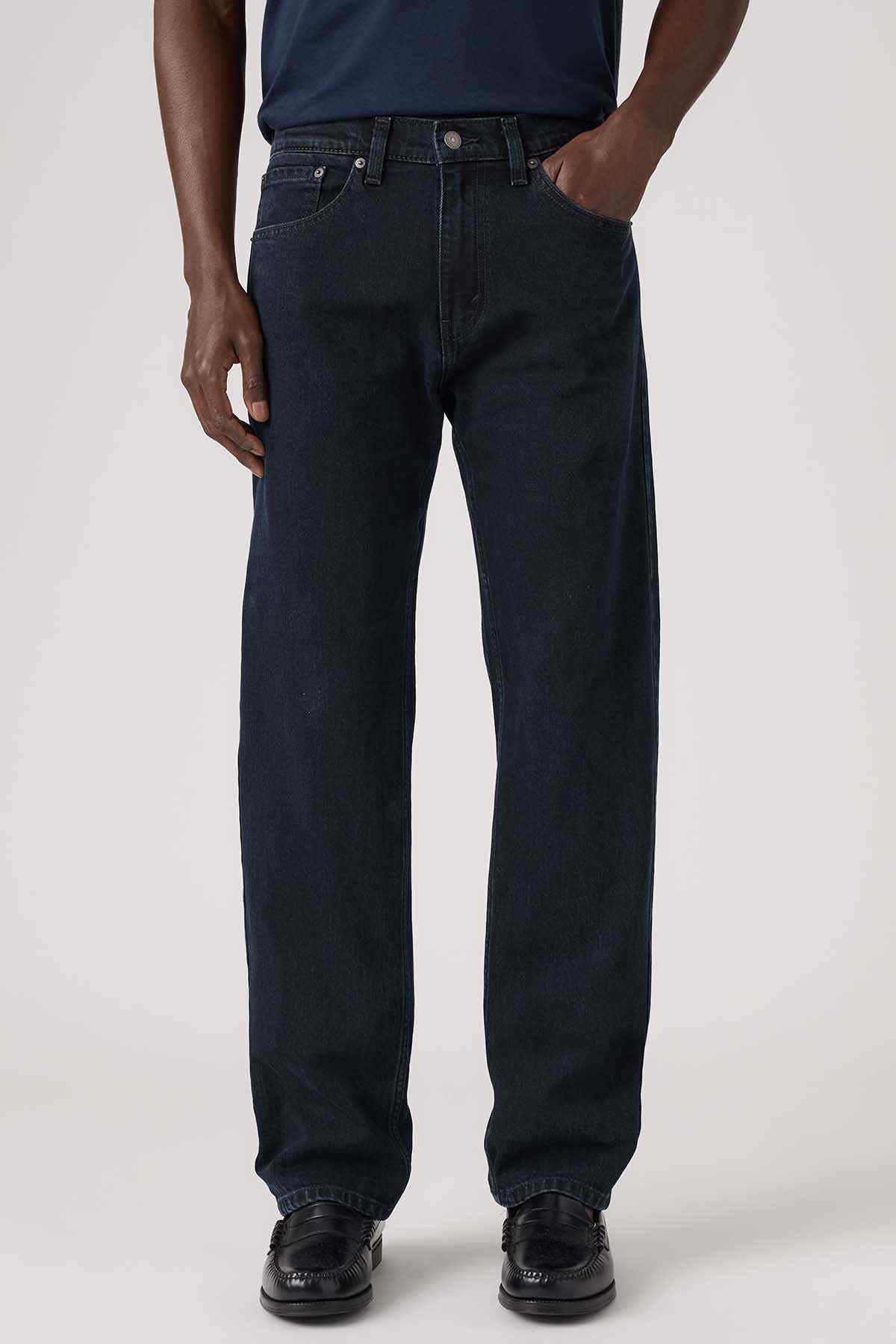 Dark blue denim jeans with front fly, button closure, and five-pocket styling