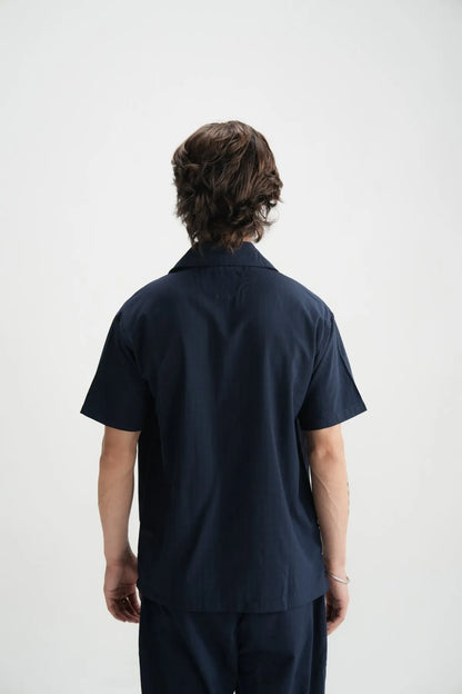Men's dark-blue short-sleeve button-up shirt, back view with collar