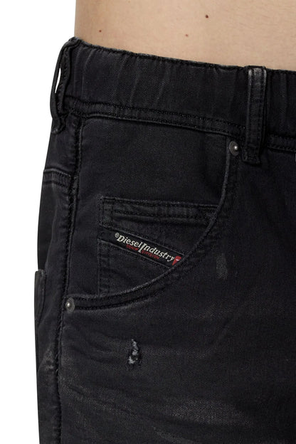 Diesel black jeans close-up of side pocket and stitched logo label