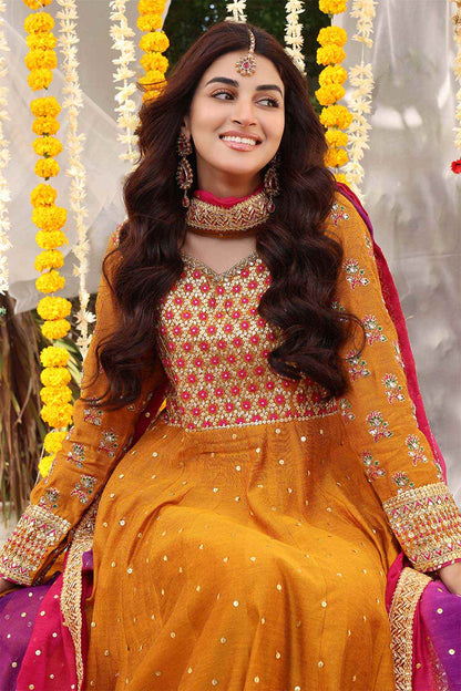 Orange long-sleeve embroidered maxi dress with gold detailing and purple draped dupatta