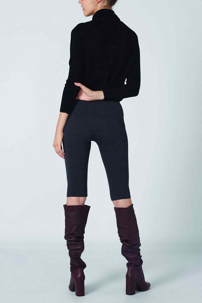 Black turtleneck and dark gray capri leggings with cropped straight hems