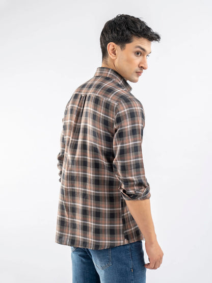 Men's plaid cotton button-up shirt, side view with long cuffed sleeves