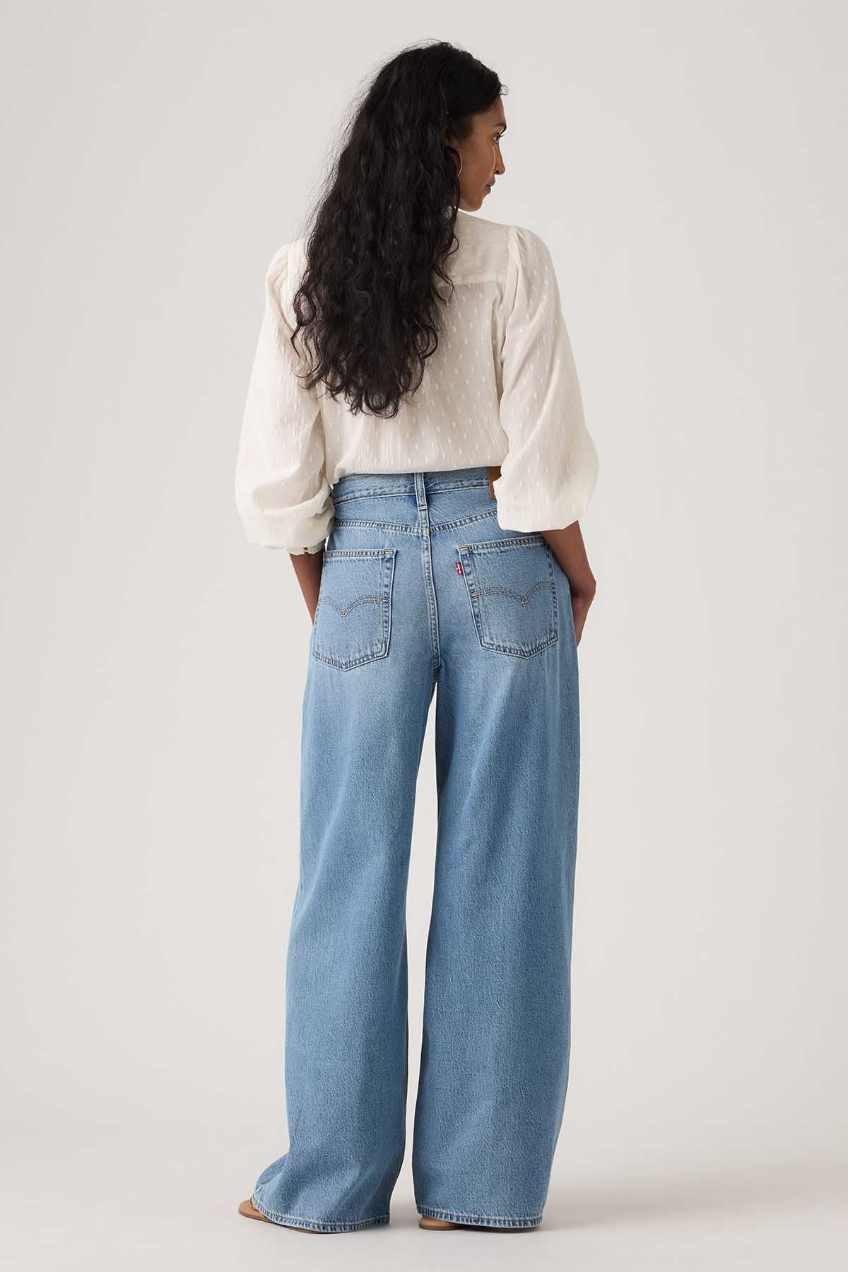 Levi's medium indigo wide-leg jeans, back view, with patch pockets