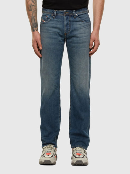 Blue denim jeans with straight legs, belt loops, and button closure