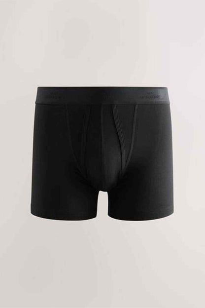 Black boxer briefs, front view with seam detail at legs and elastic waistband, NEXT logo