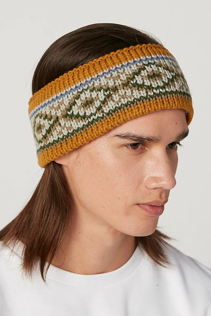 Striped knit headband in mustard, cream, blue, and green with ribbed edge