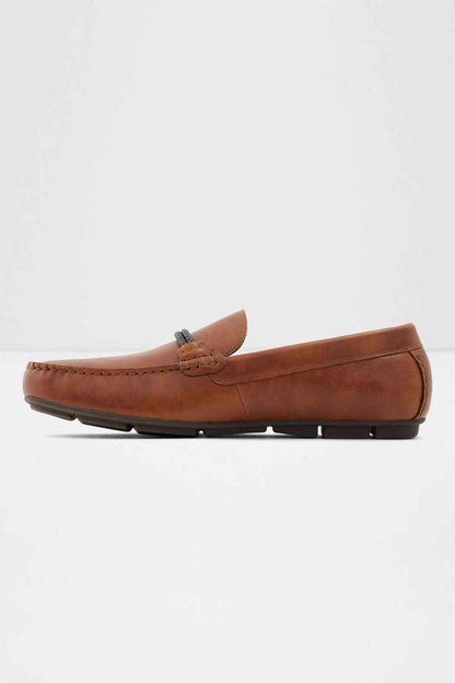 Cognac loafer shoes with strap ornament and black tread sole