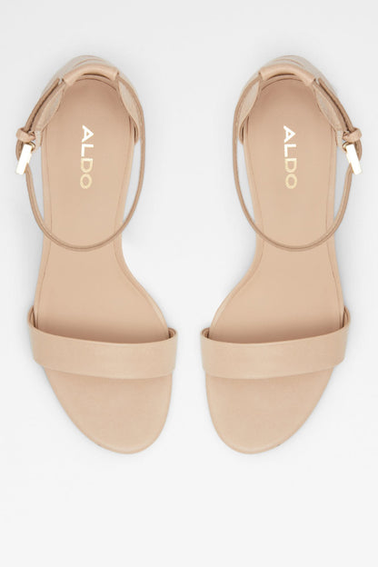 Pair of bone heeled sandals showing open toe and ankle strap